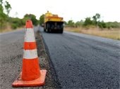 stock photo of paving street with orange cone