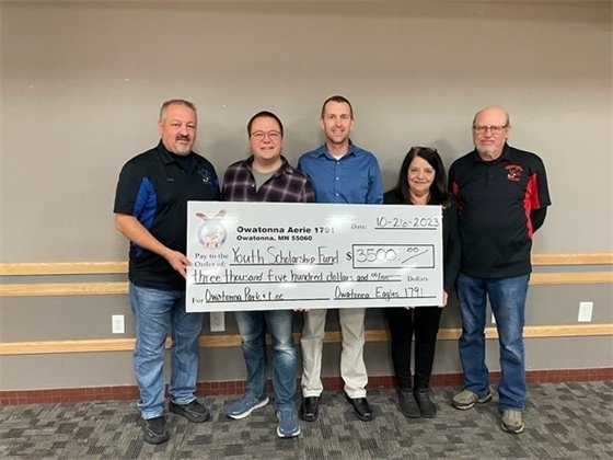 Photo of check presentation supporting youth sports