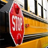 Stock photo of school bus stop sign