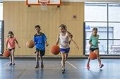 stock photo of kids playing basketball