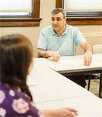 Photo of Housing Manager Ghassan Madkour meeting with HRA applicant