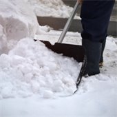 Stock photo of person shoveling snow