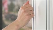 Stock photo of hand knocking on door