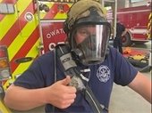 Closeup of Owatonna firefighter doing confined space training