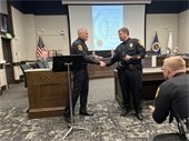Chief Mundale congratulates Detective Travis Ardolf on his Commendation.