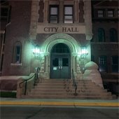 City Hall with green lights for Veteran's Day