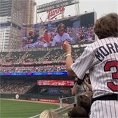 Twin's fan on jumbotron at baseball game