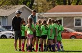 Coach and soccer team photo