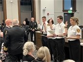 Mayor Jessop swearing in new fire personnel Jacob Dashiell, Justin Beman, Isaac Potter and Katherine Pepp (left to right).