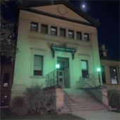 City Hall with green lights for Veteran's Day