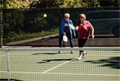 Photo of pickleball players at outdoor court