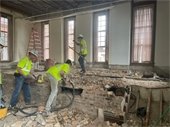 Photo of construction crew demolishing interior of Council Chambers