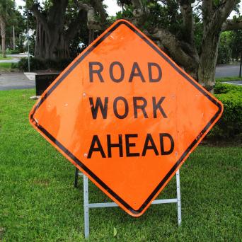 Road Work Ahead Sign in grass